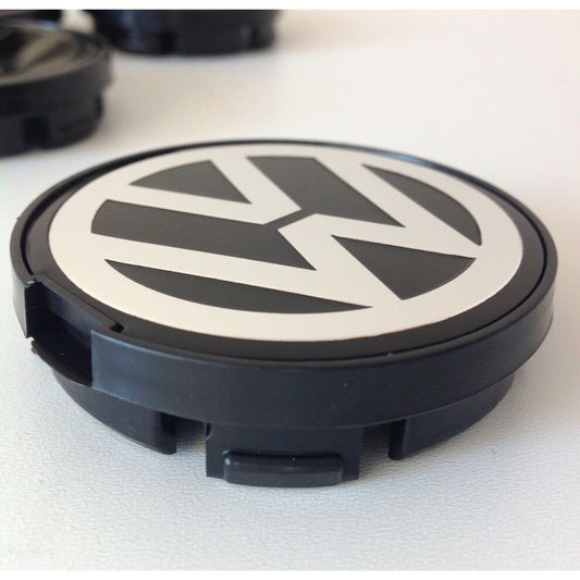 Single 55mm Volkswagen wheel centre cap close-up with VW logo