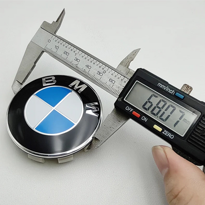 BMW wheel centre cap 68mm measured with caliper showing size accuracy