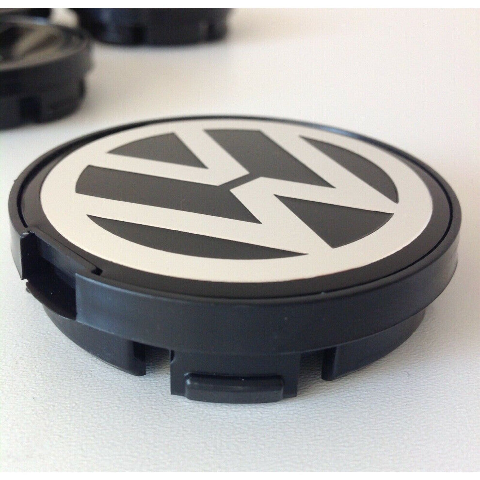 Single 55mm Volkswagen wheel centre cap close-up with VW logo